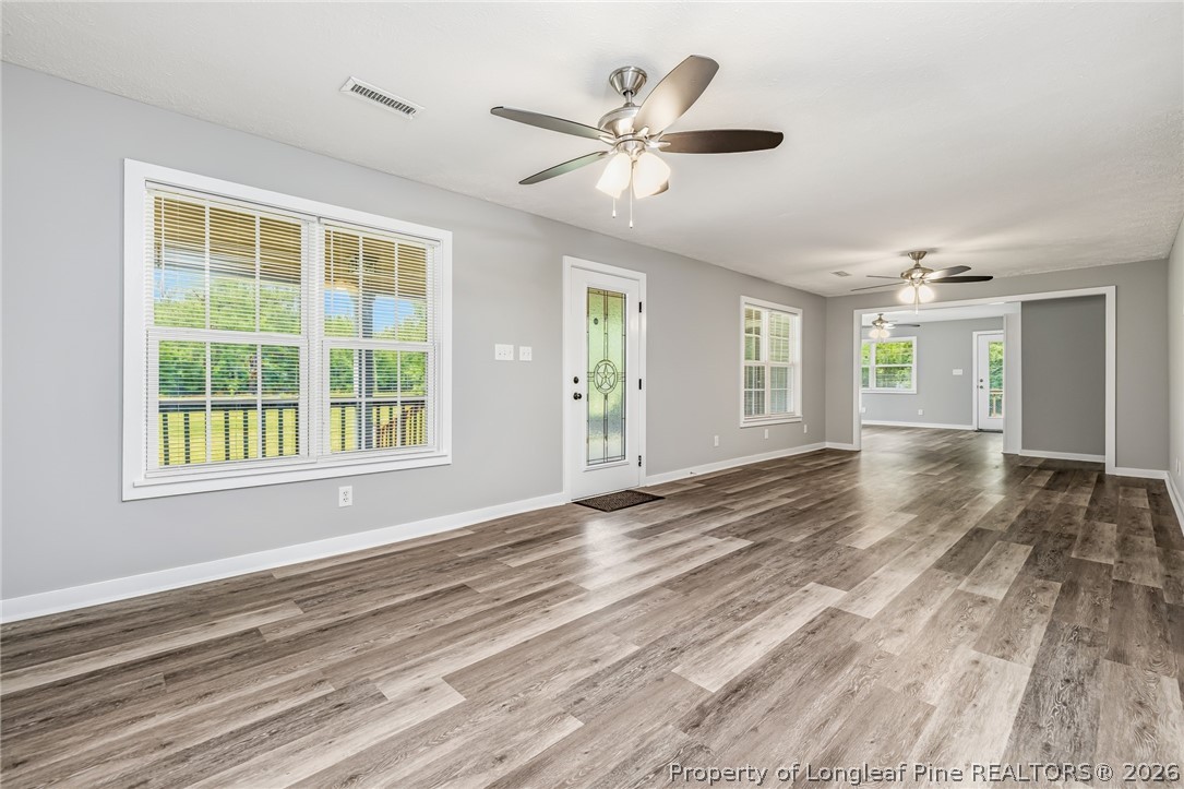 3524 Pine Log Road Lumberton, NC 28360 - Photo 5 of 42 a view of an empty room with a window and a kitchen