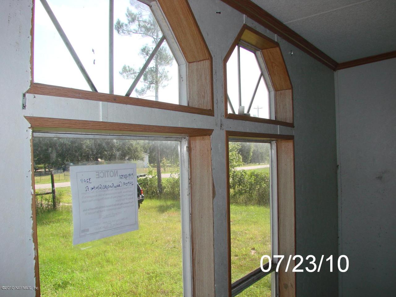 24904 Crawford Road Callahan, FL 32011 - Photo 17 of 25 FRONT VIEW THRU WINDOWS