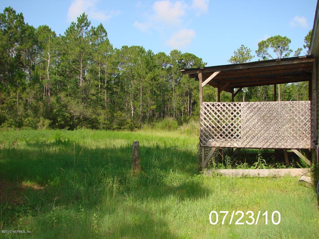 24904 Crawford Road Callahan, FL 32011 - Photo 3 of 25 VIEW OF BACKYARD & DECK