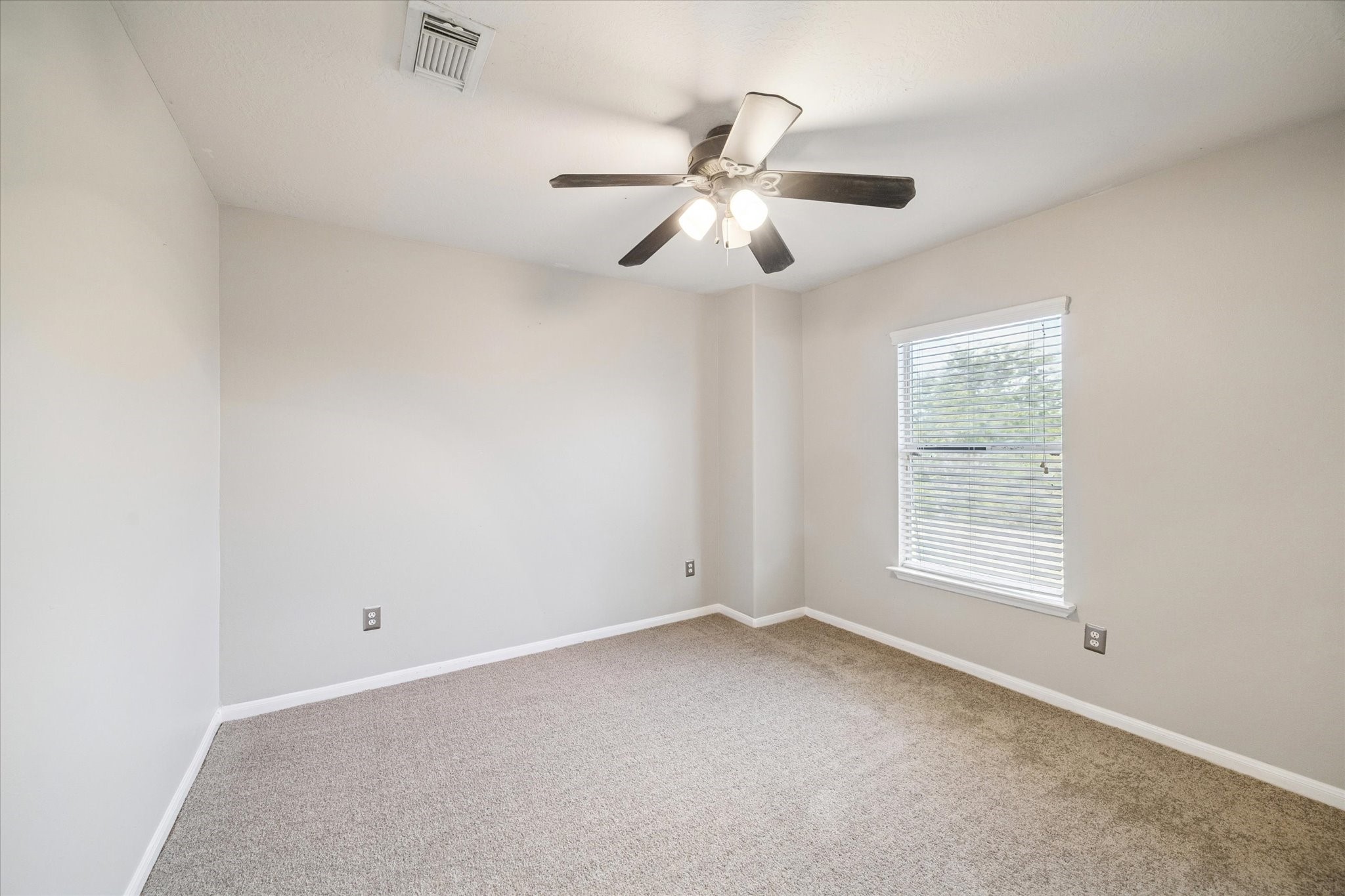 5243 El Tigre Lane Baytown, TX 77521 - Photo 20 of 29 a view of an empty room with a window