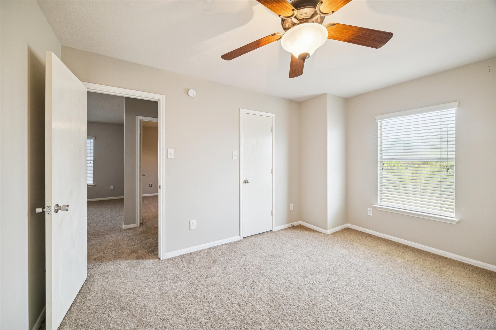 5243 El Tigre Lane Baytown, TX 77521 - Photo 23 of 29 an empty room with fan and windows