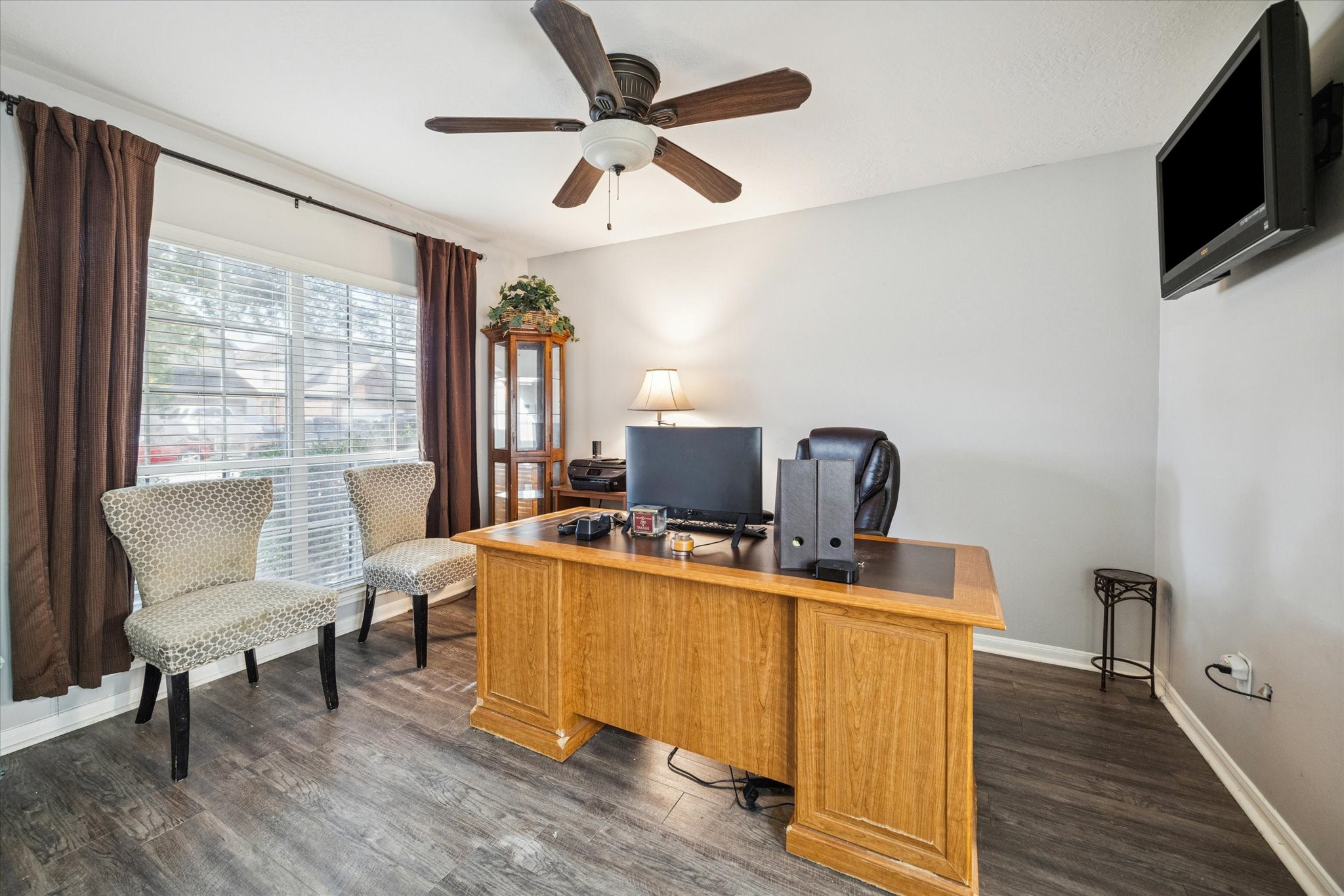 5243 El Tigre Lane Baytown, TX 77521 - Photo 5 of 29 a view of a workspace with furniture and a window