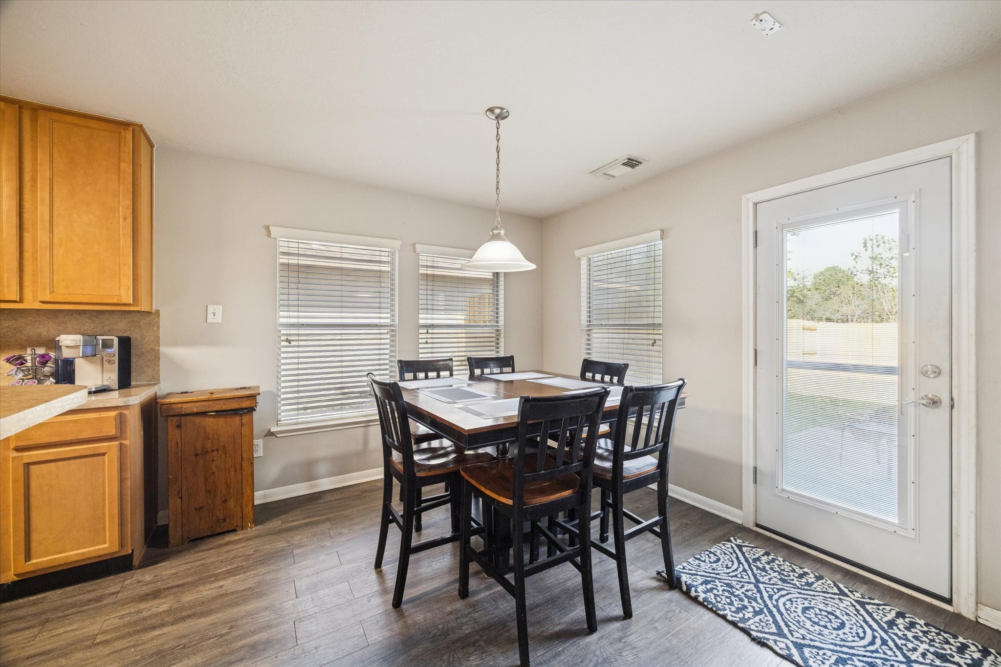 5243 El Tigre Lane Baytown, TX 77521 - Photo 6 of 29 a view of a dining room with furniture window and wooden floor