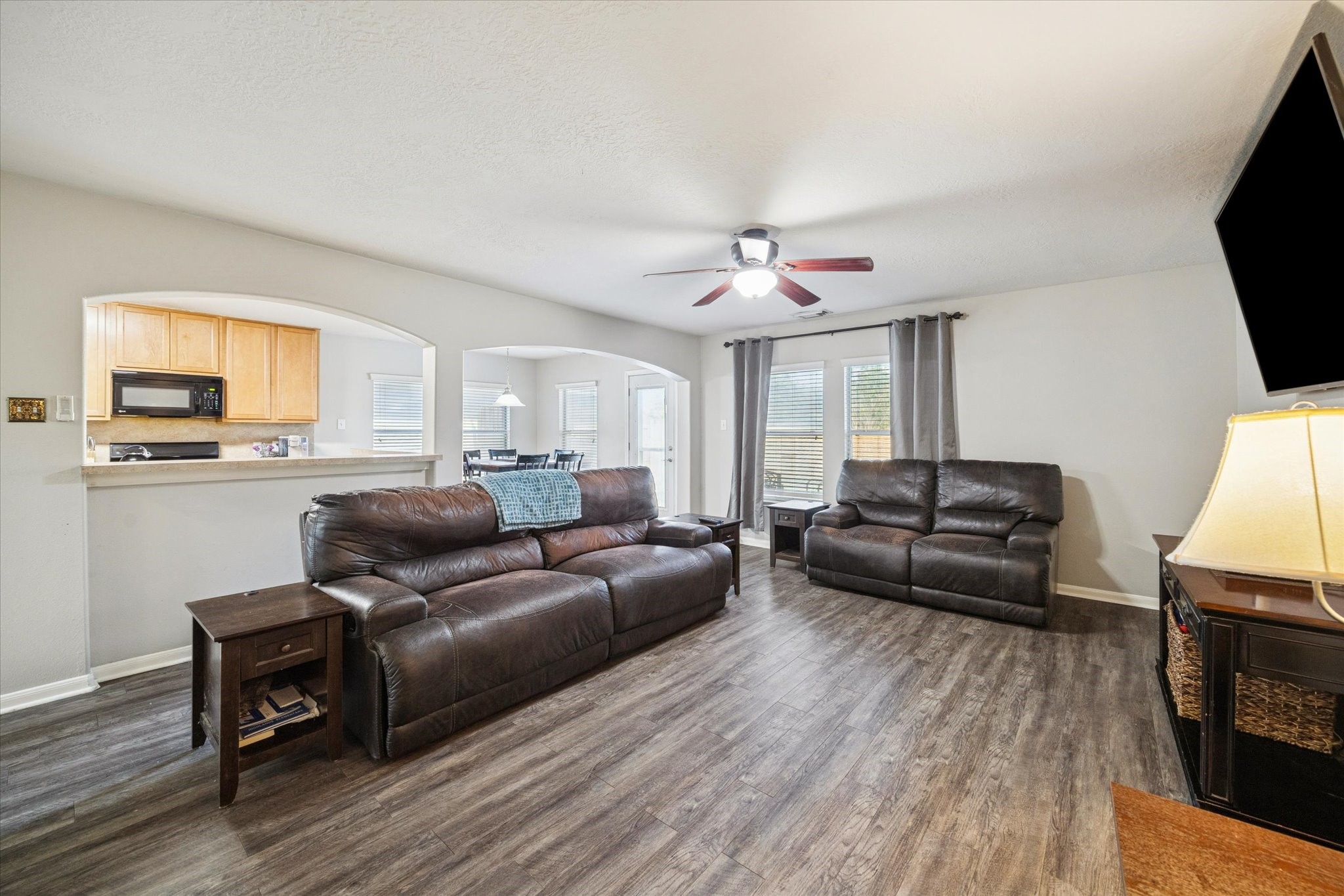 5243 El Tigre Lane Baytown, TX 77521 - Photo 10 of 29 a living room with furniture and a flat screen tv