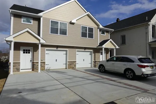 a view of a car parked in front of a house