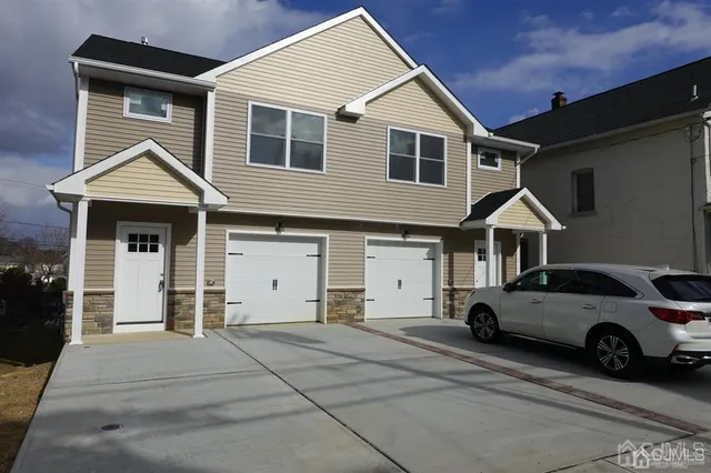 a view of a car park in front of house