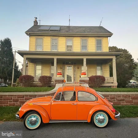a car parked in front of a house
