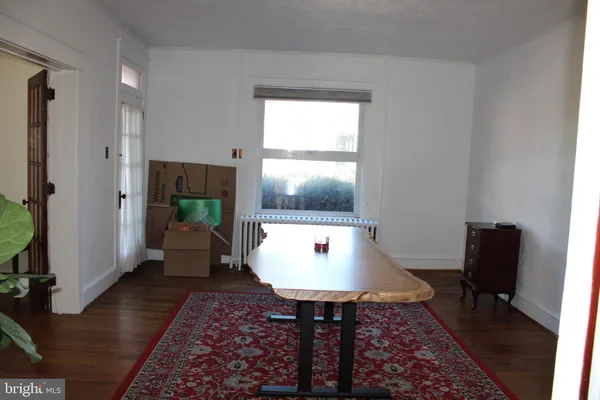 a living room with table and a couch