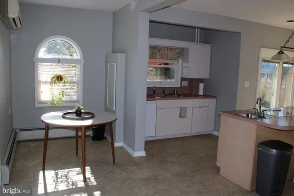 a view of a kitchen area with furniture and window