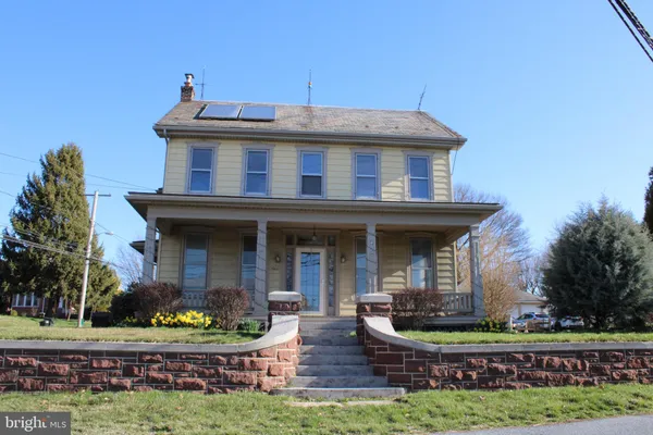 front view of a house with a yard