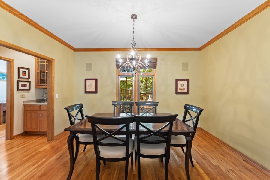 324 North County Line Road Hinsdale, IL 60521 - Photo 9 of 32 a view of a dining room with furniture window and wooden floor