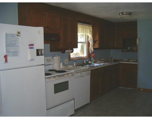 183 Lucerne Road Springfield, MA 01119 - Photo 13 of 20 a kitchen with a sink a stove and white cabinets