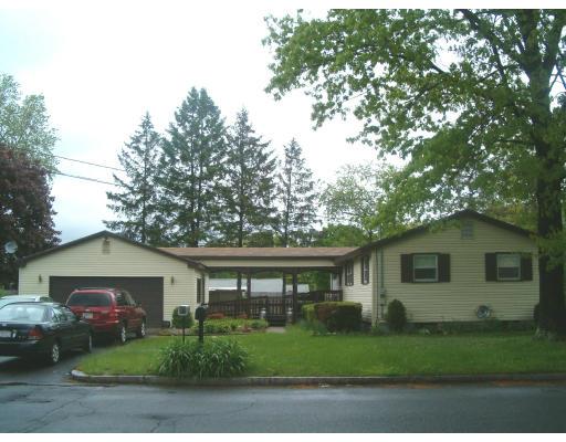183 Lucerne Road Springfield, MA 01119 - Photo 2 of 20 a front view of a house with a garden