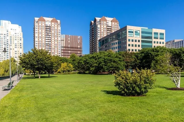 a view of a big yard next to a tall building