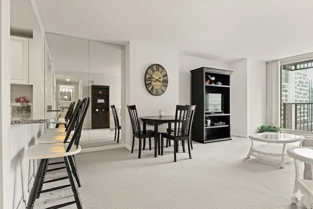a view of a livingroom with furniture and entryway