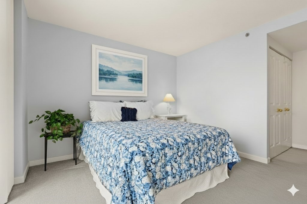 8 Museum Way, Unit 1103 Cambridge, MA 02141 - Photo 13 of 42 a bedroom with a bed and a painting on the wall