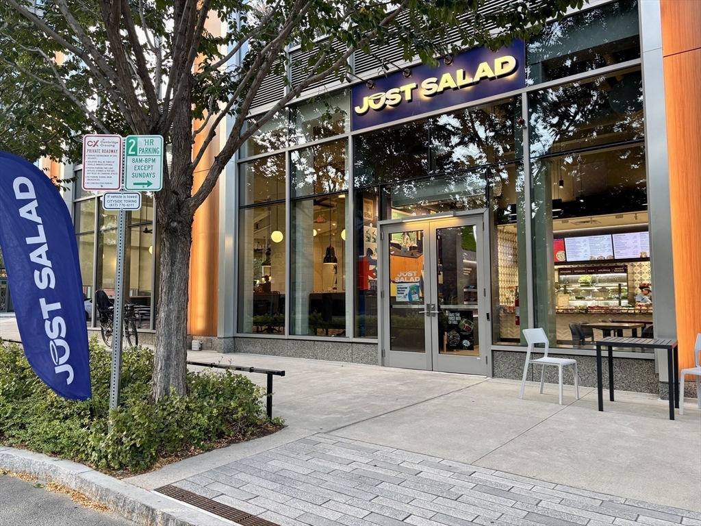8 Museum Way, Unit 1103 Cambridge, MA 02141 - Photo 32 of 42 a view of a building with a tree in front of retail shop