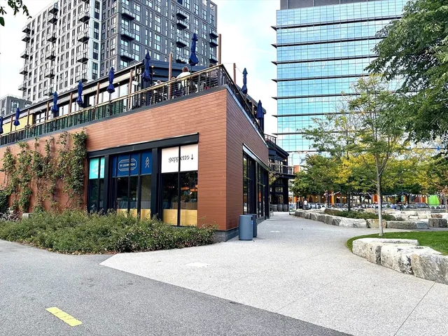 a view of a street with a park