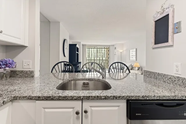 a kitchen with granite countertop a sink and a granite counter tops