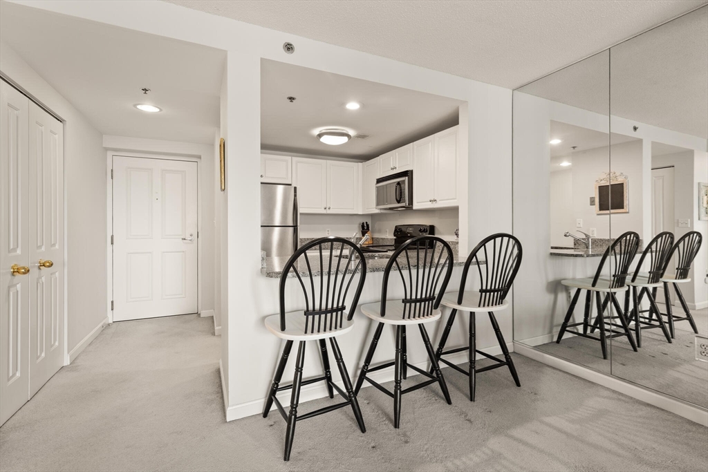 8 Museum Way, Unit 1103 Cambridge, MA 02141 - Photo 10 of 42 a view of a dining area with furniture