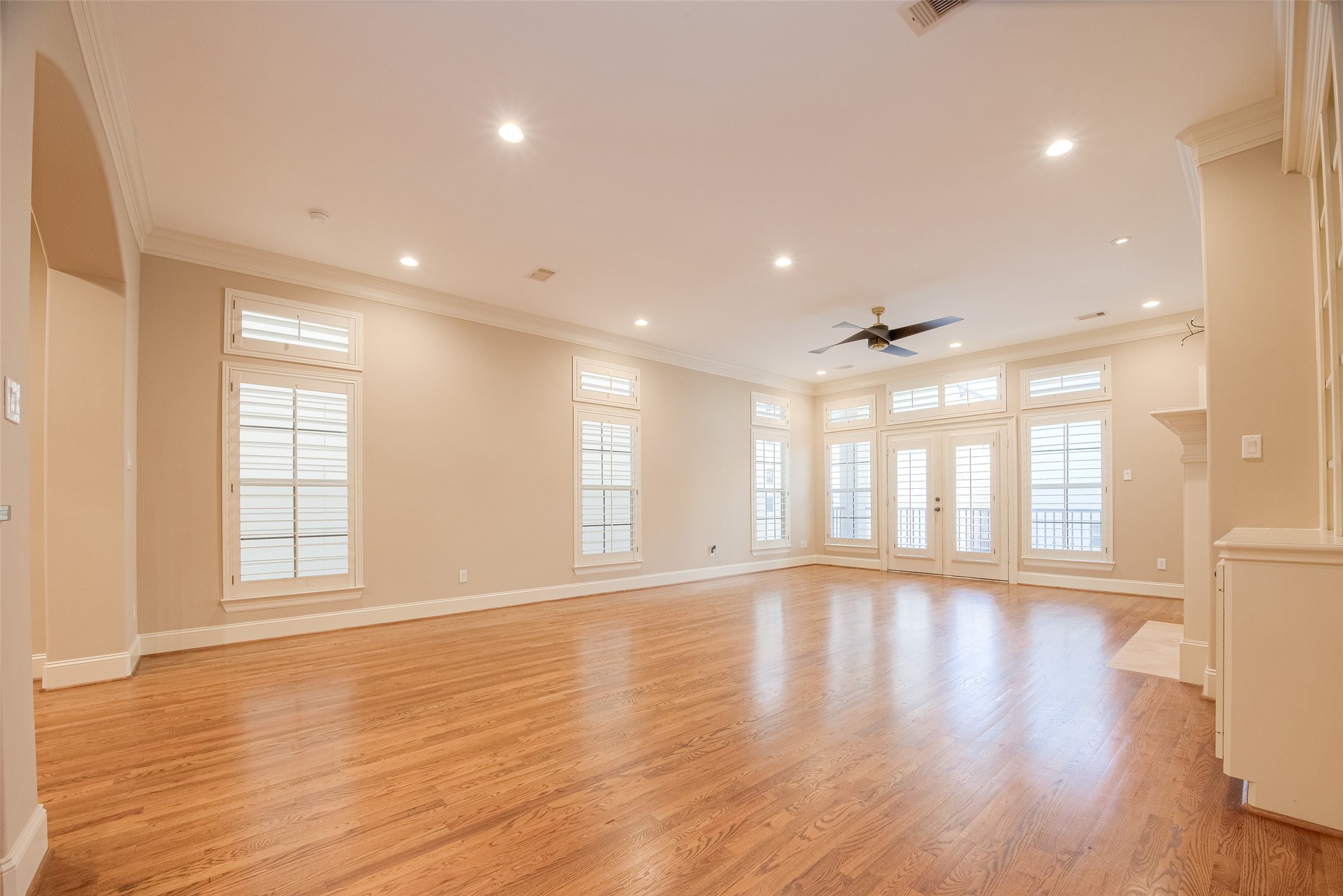 232 Detering Street, Unit A Houston, TX 77007 - Photo 14 of 46 The Living Room Features Real Wood Floors, Recessed Lighting, Ceiling Fan, Plantation Shutters.