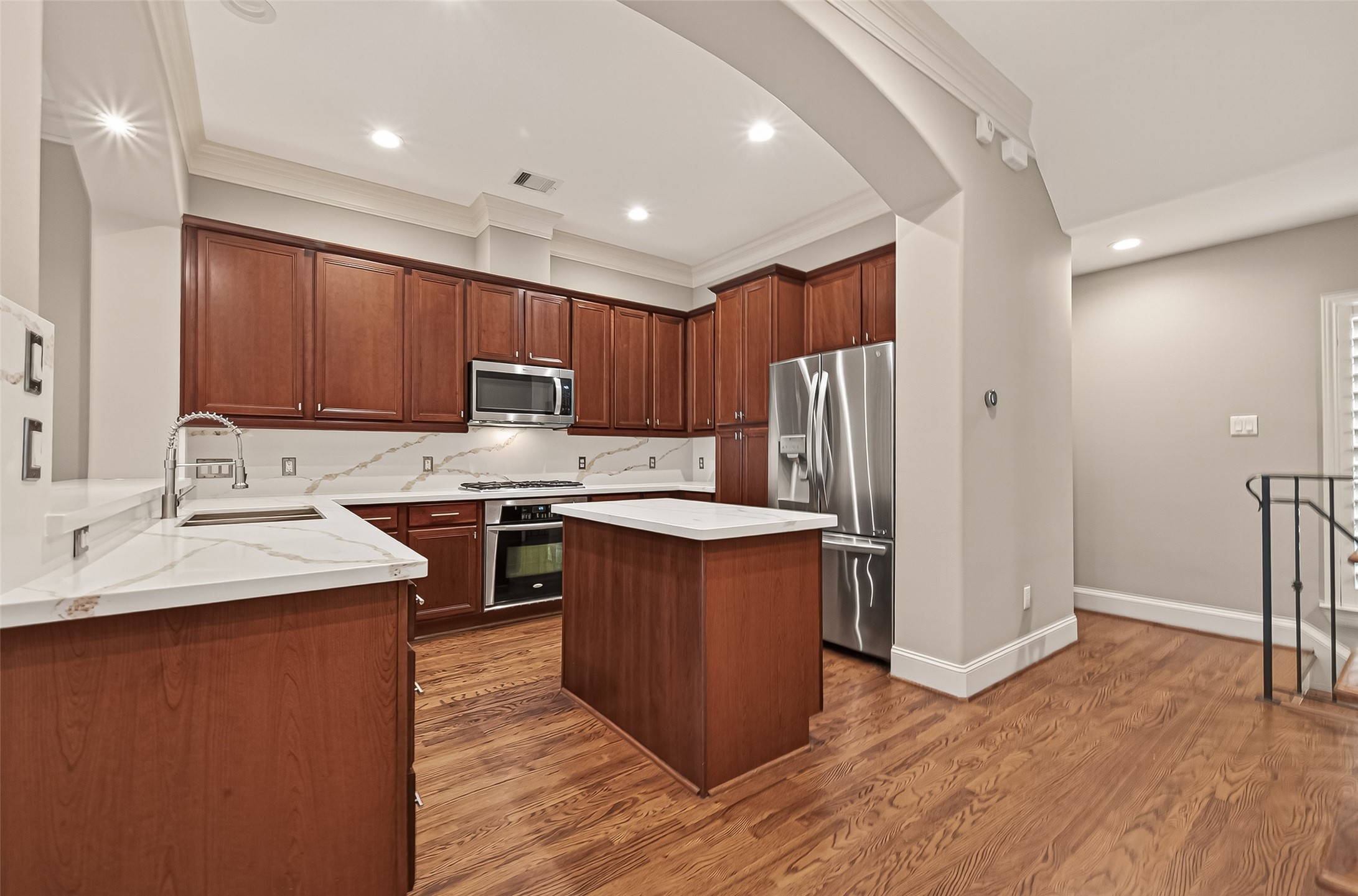 232 Detering Street, Unit A Houston, TX 77007 - Photo 17 of 46 The Kitchen Is Bright and Features Recessed Lighting and Under Cabinet Lighting and Updated Quartz Countertops