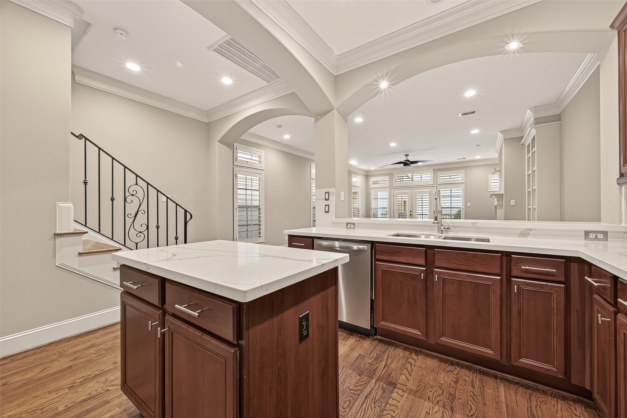 232 Detering Street, Unit A Houston, TX 77007 - Photo 19 of 46 Island has Electric Outlet for Convenience. Kitchen has Elegant Archways and is Right next to the Staircase with Wrought Iron Spindles Leading to Third Floor