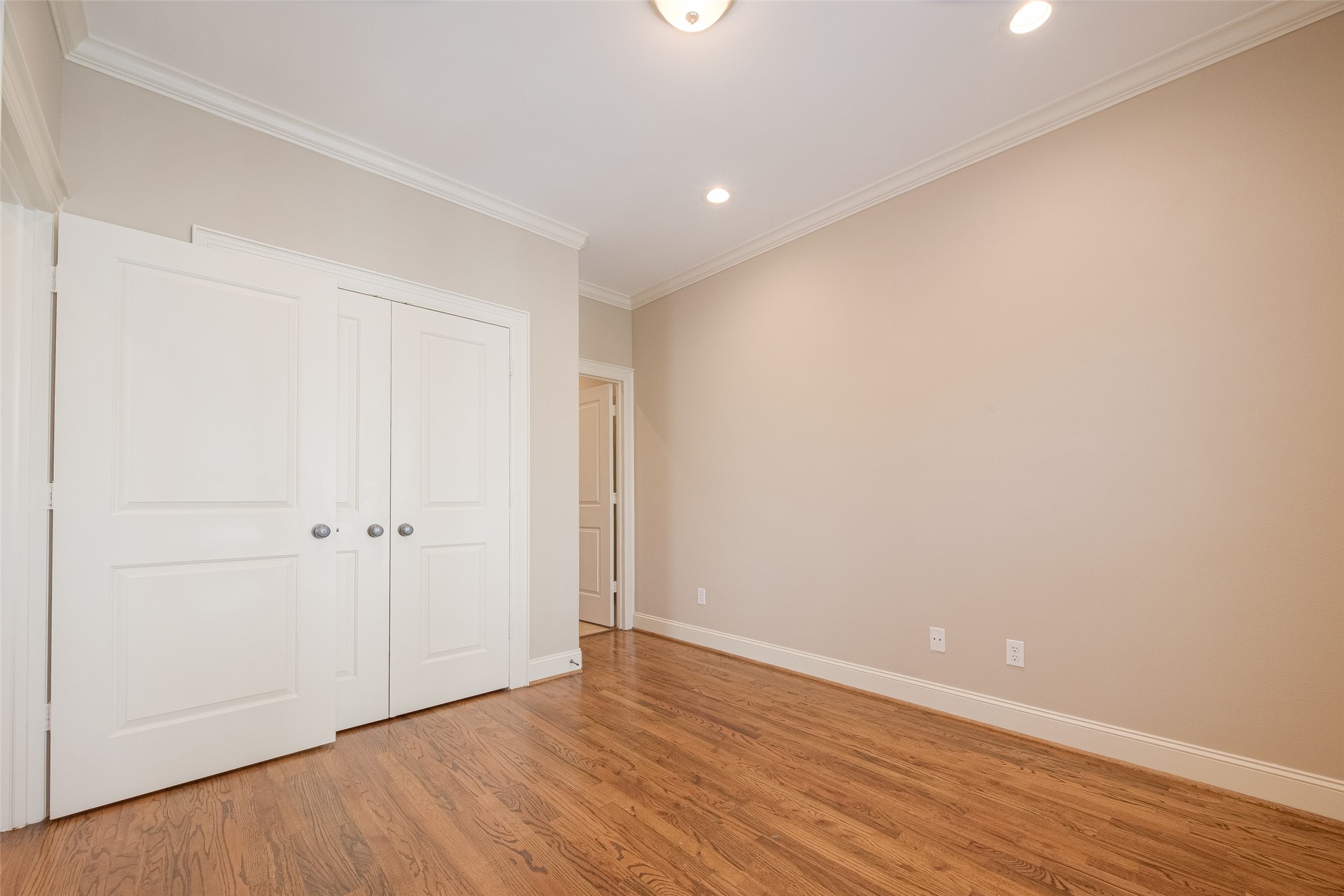 232 Detering Street, Unit A Houston, TX 77007 - Photo 25 of 46 Secondary Bedroom features Recessed Lighting, Crown Molding, and Large closet