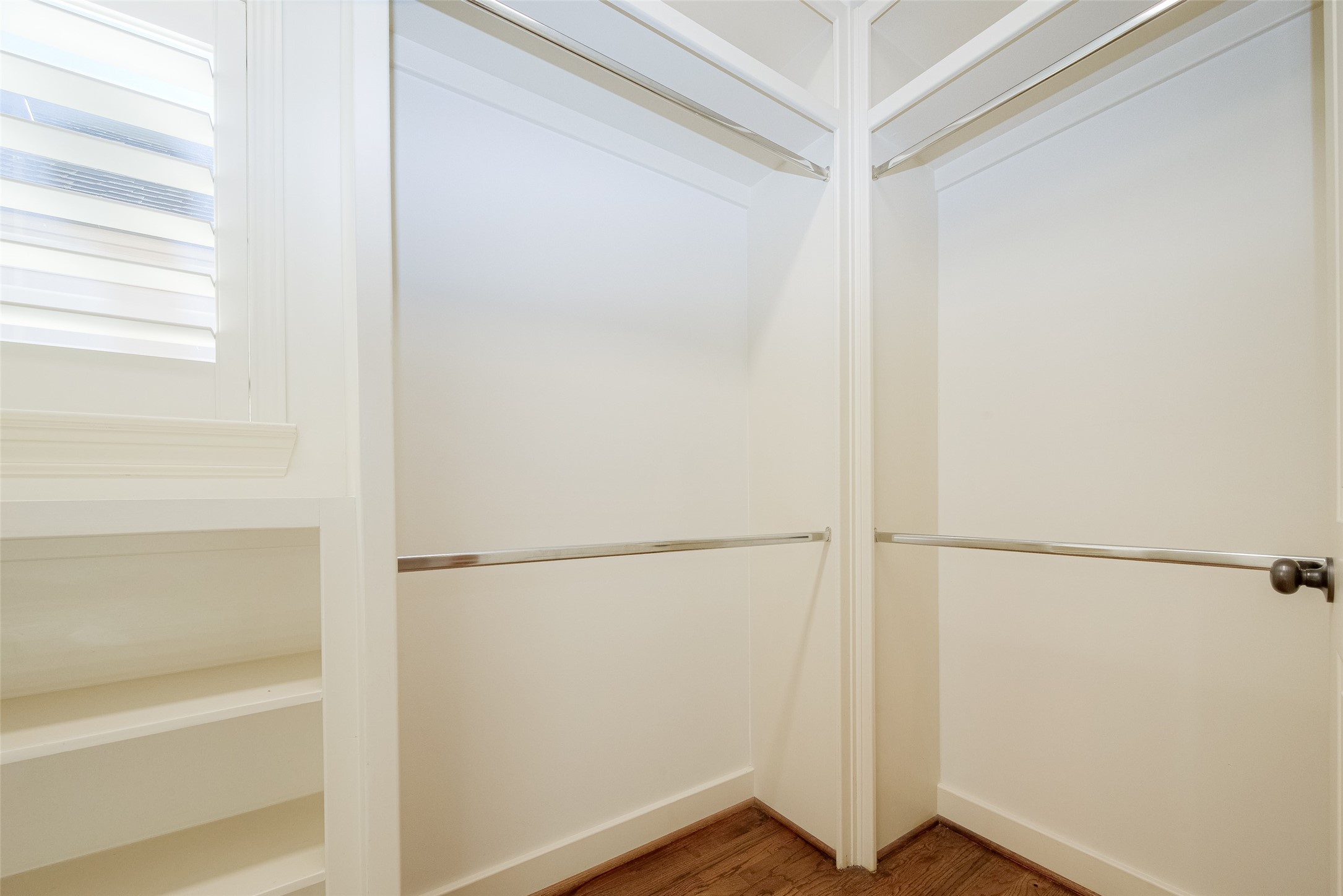 232 Detering Street, Unit A Houston, TX 77007 - Photo 30 of 46 One of the TWO Closets in Primary Bedroom with Plantation Shutters to Match the Rest of the Home and has Ample Rods for Hanging your Wardrobe