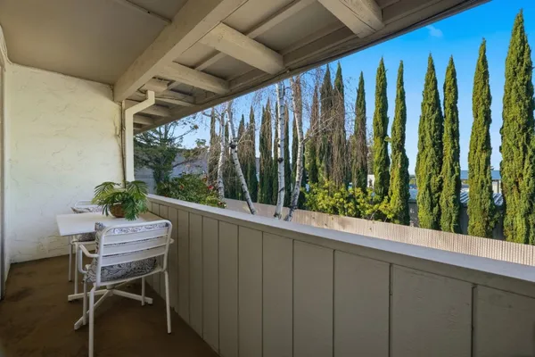 a view of a chairs and table in a patio