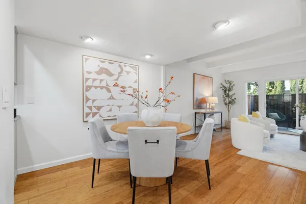 a living room with furniture and wooden floor