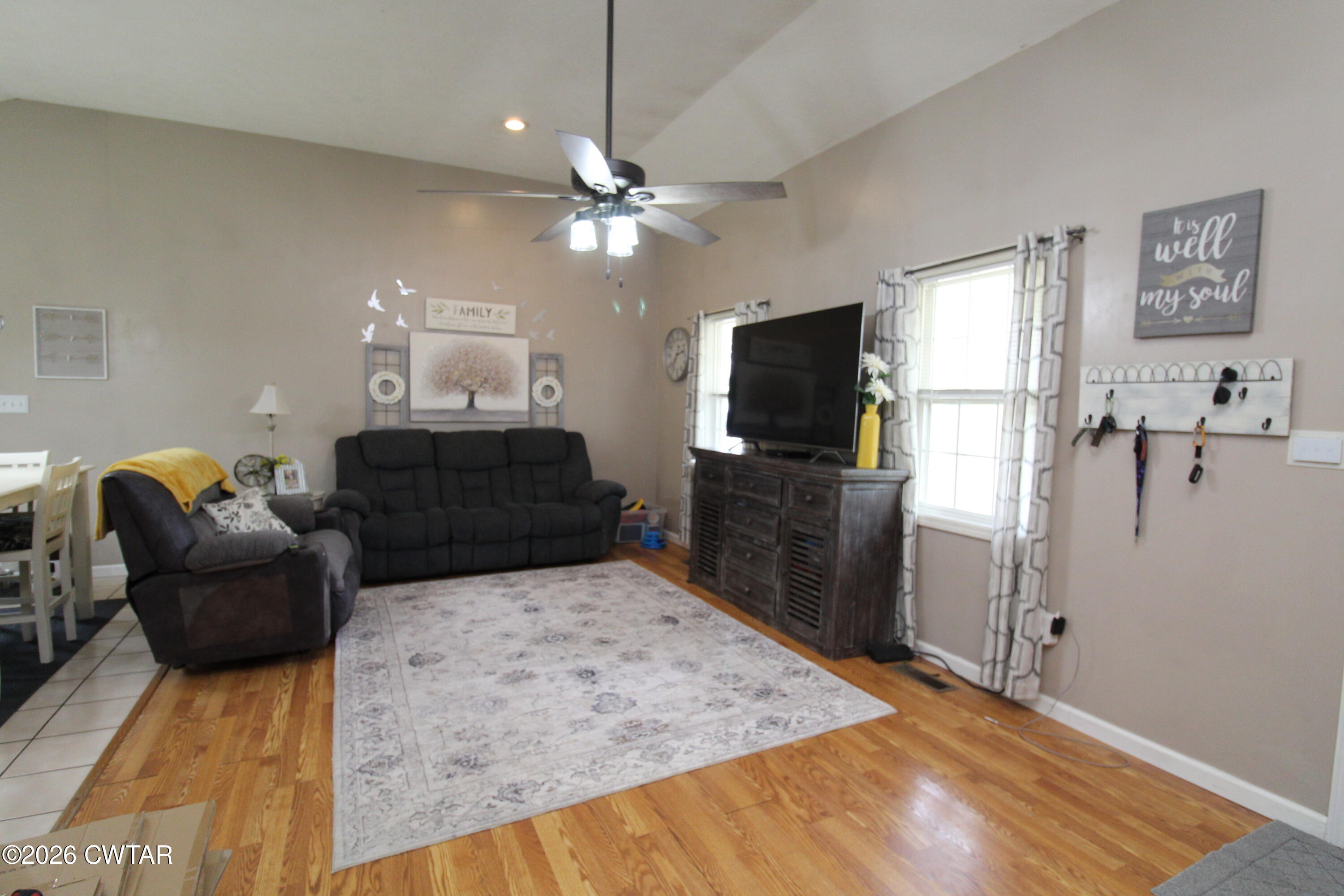 81 Monk Circle Lexington, TN 38351 - Photo 11 of 21 a living room with furniture a flat screen tv and kitchen view