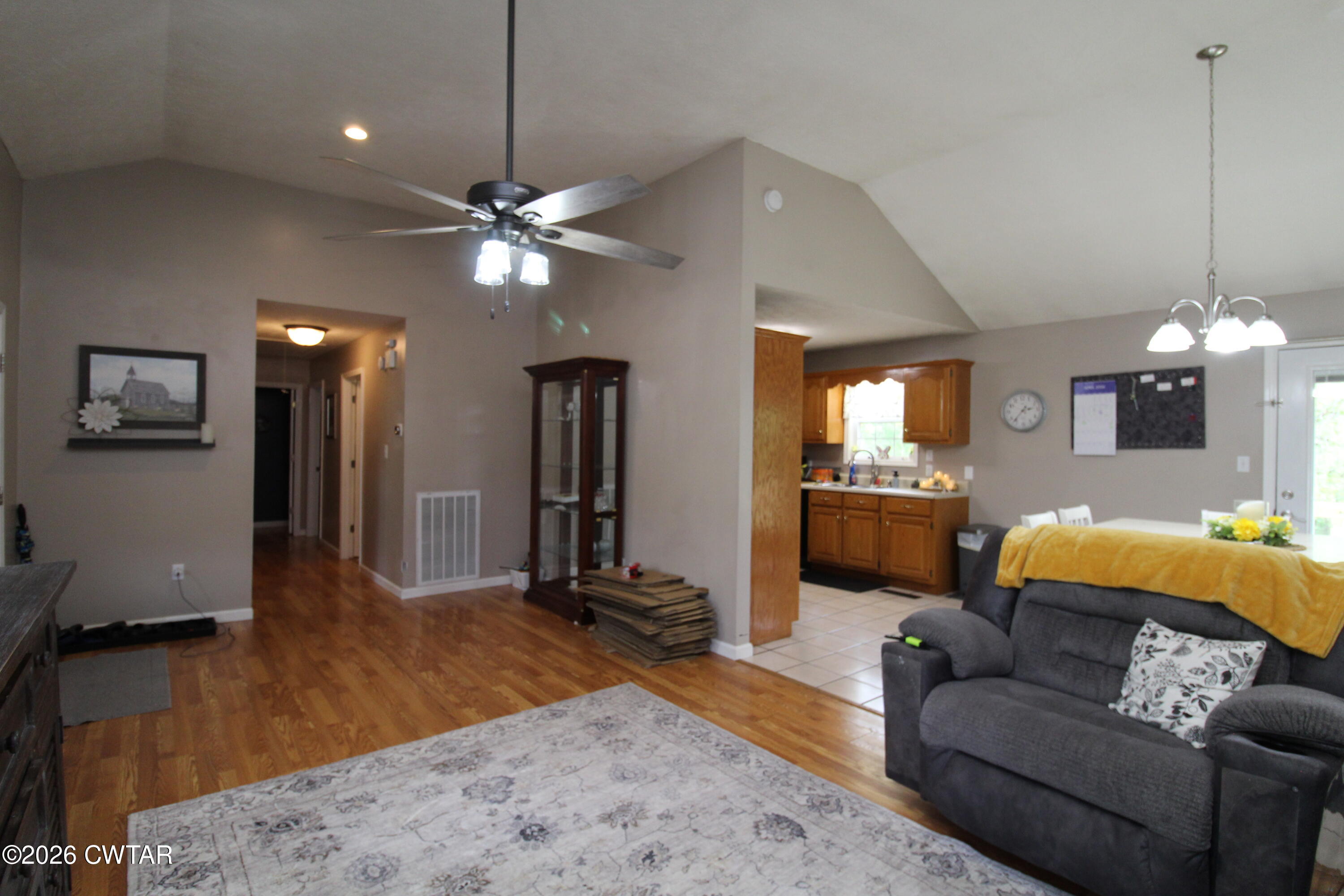 81 Monk Circle Lexington, TN 38351 - Photo 12 of 21 a living room with furniture and a chandelier