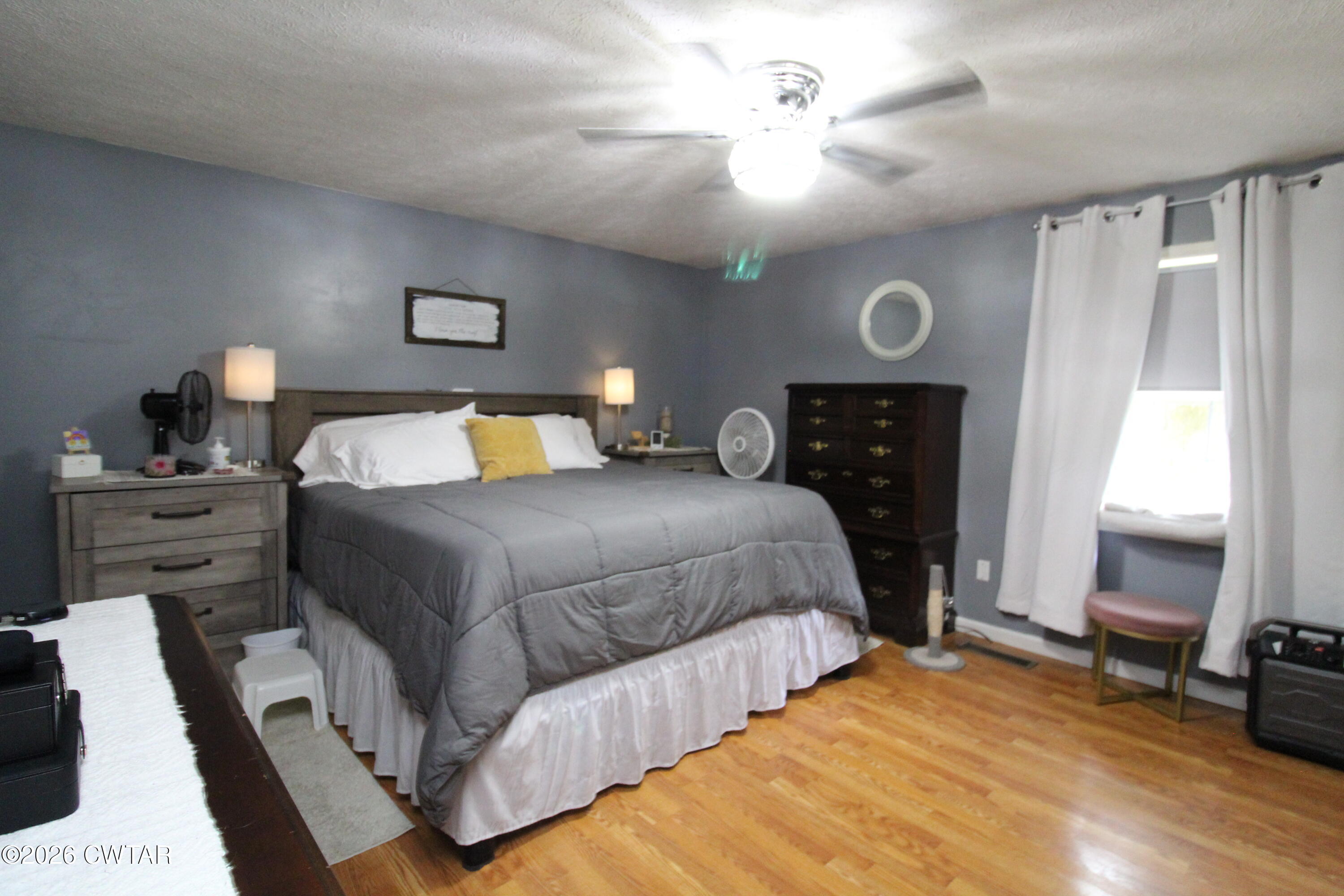 81 Monk Circle Lexington, TN 38351 - Photo 13 of 21 a bedroom with a bed and a chandelier
