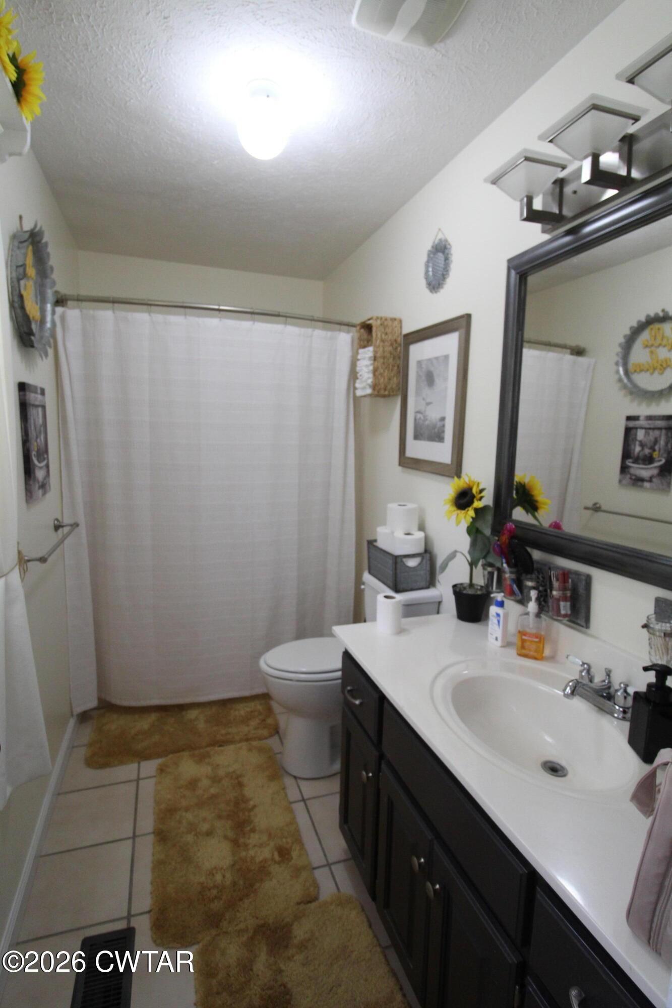 81 Monk Circle Lexington, TN 38351 - Photo 16 of 21 a bathroom with a sink a toilet and mirror