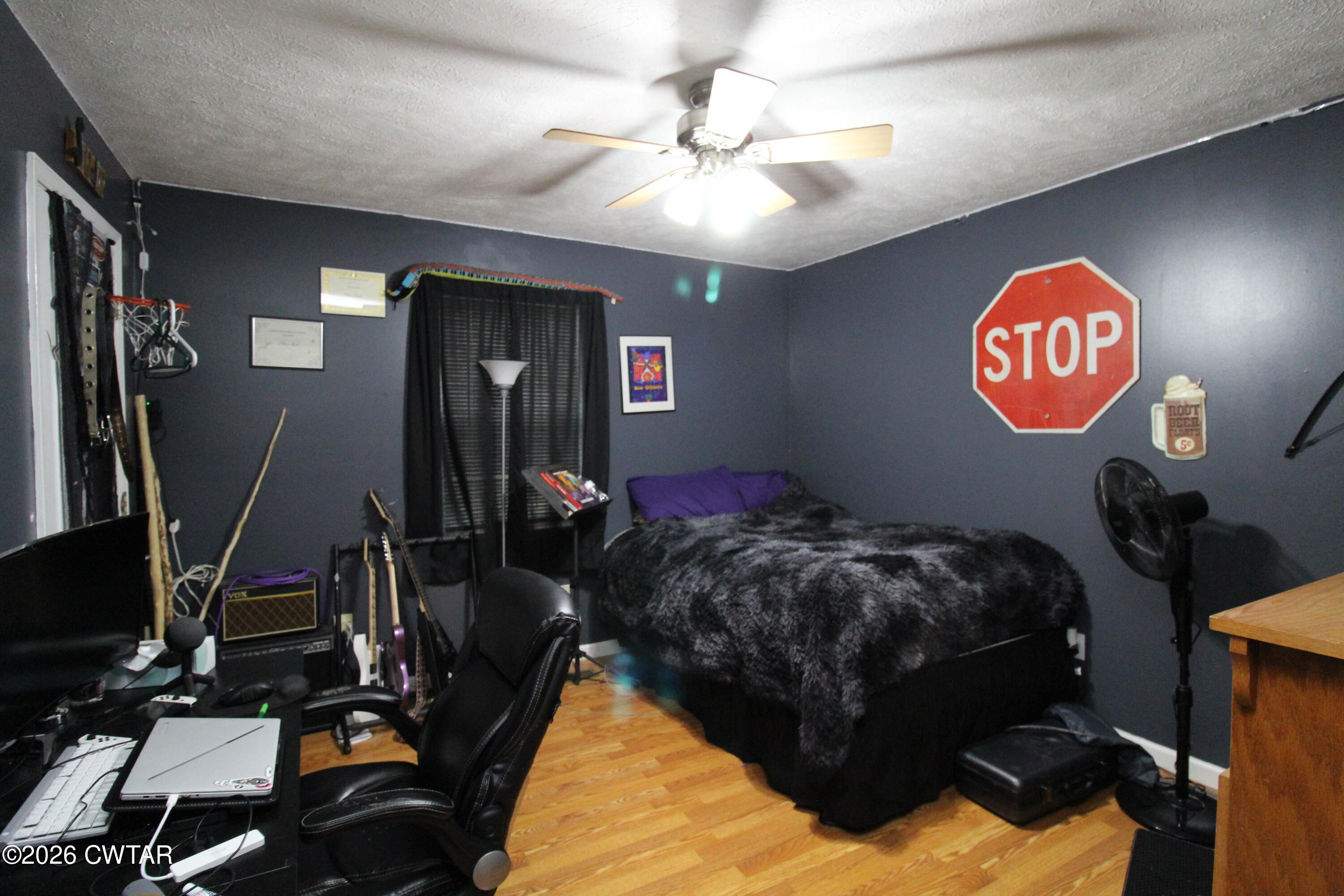 81 Monk Circle Lexington, TN 38351 - Photo 17 of 21 a bed room with a bed and a gym equipment
