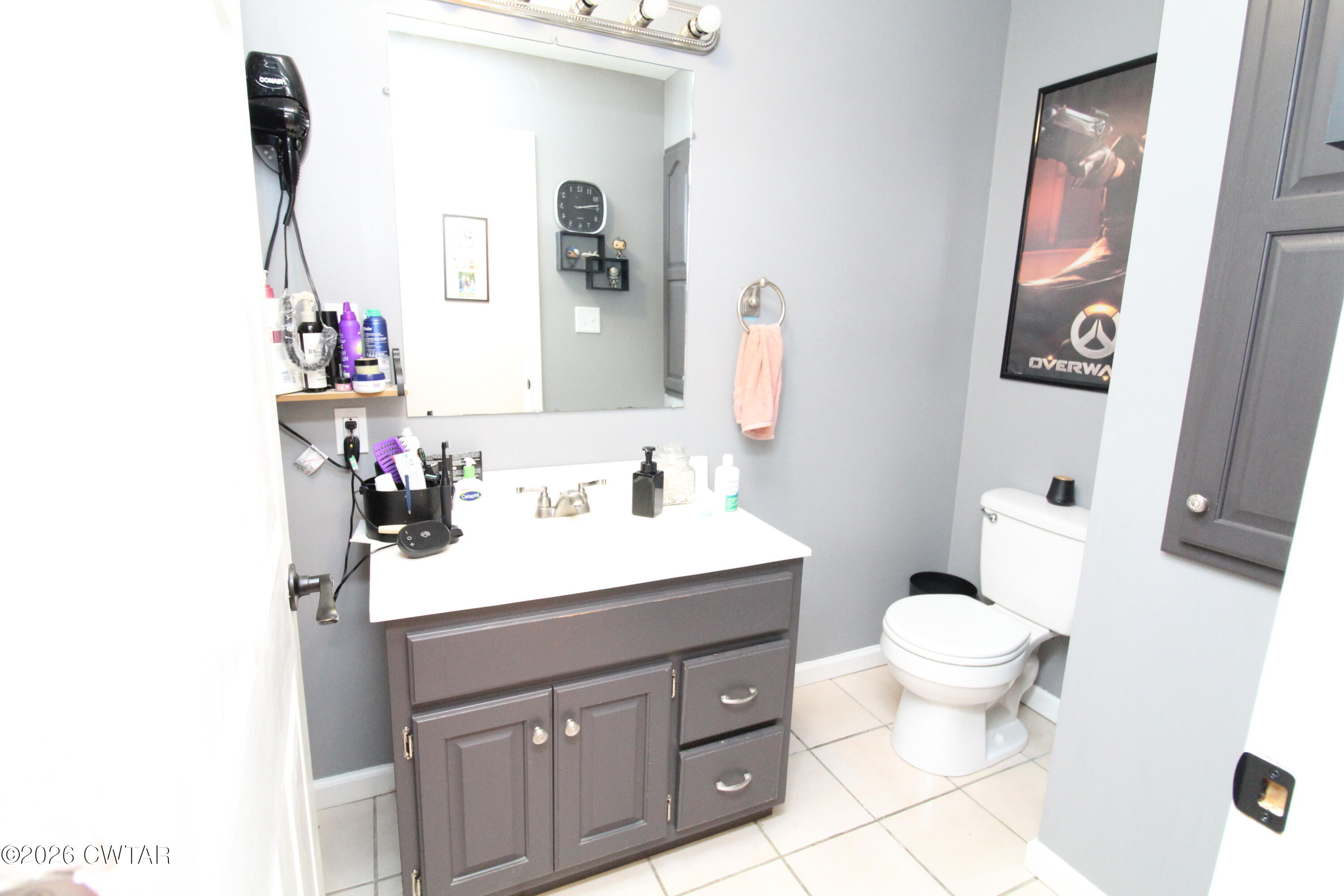 81 Monk Circle Lexington, TN 38351 - Photo 18 of 21 a bathroom with a sink vanity mirror and toilet