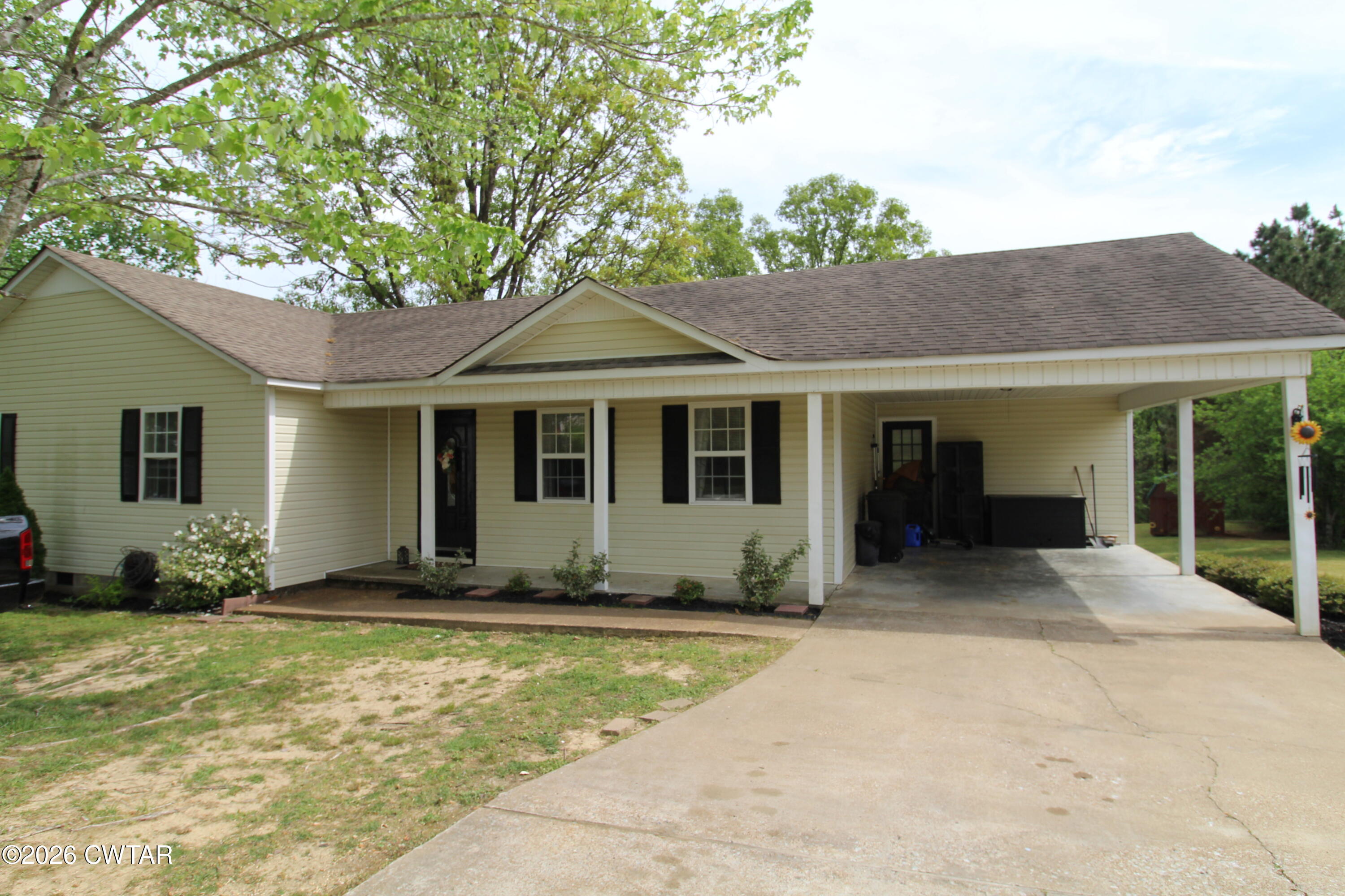 81 Monk Circle Lexington, TN 38351 - Photo 21 of 21 a front view of a house with a garden