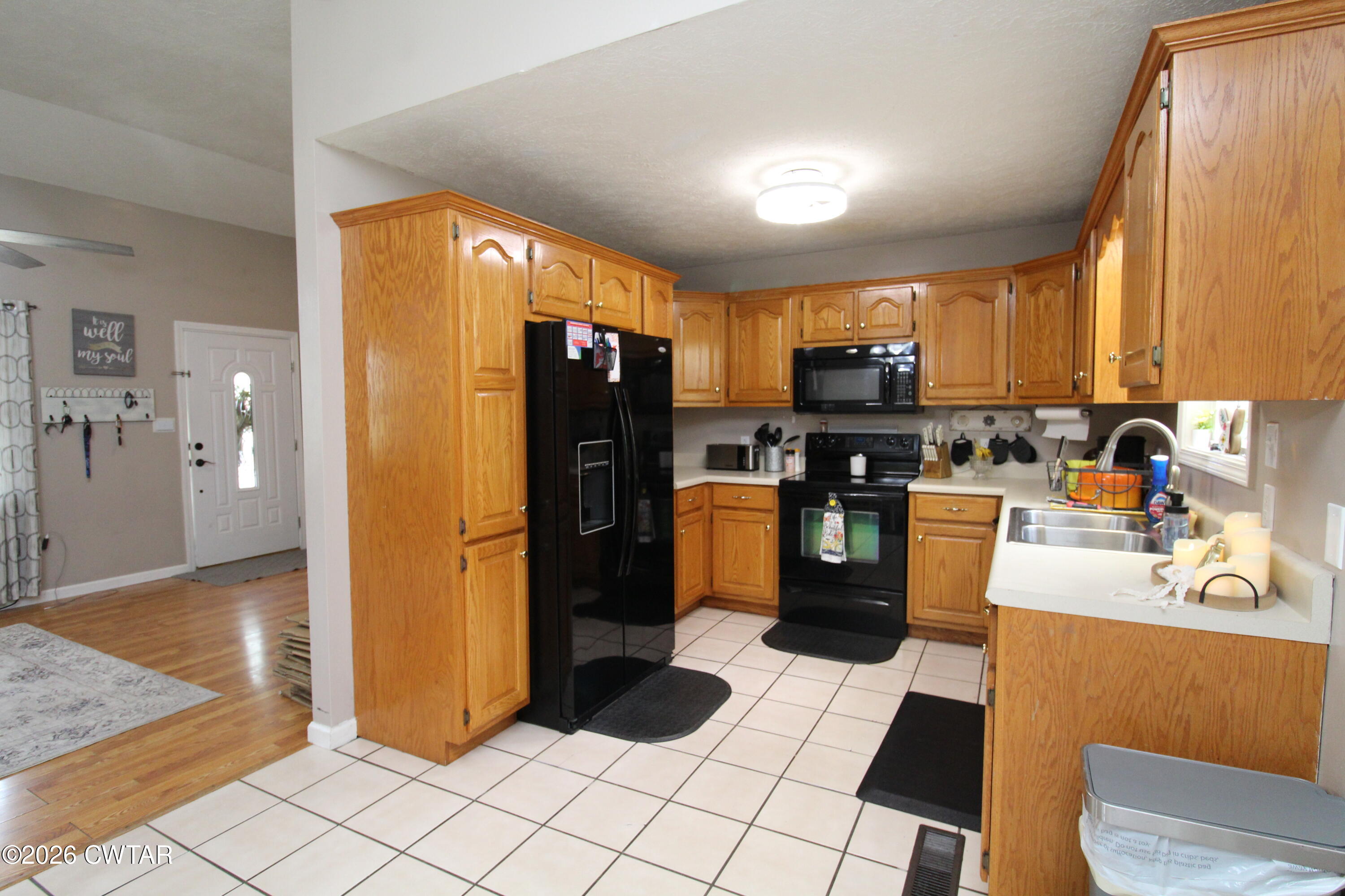 81 Monk Circle Lexington, TN 38351 - Photo 8 of 21 a kitchen with a refrigerator and a stove