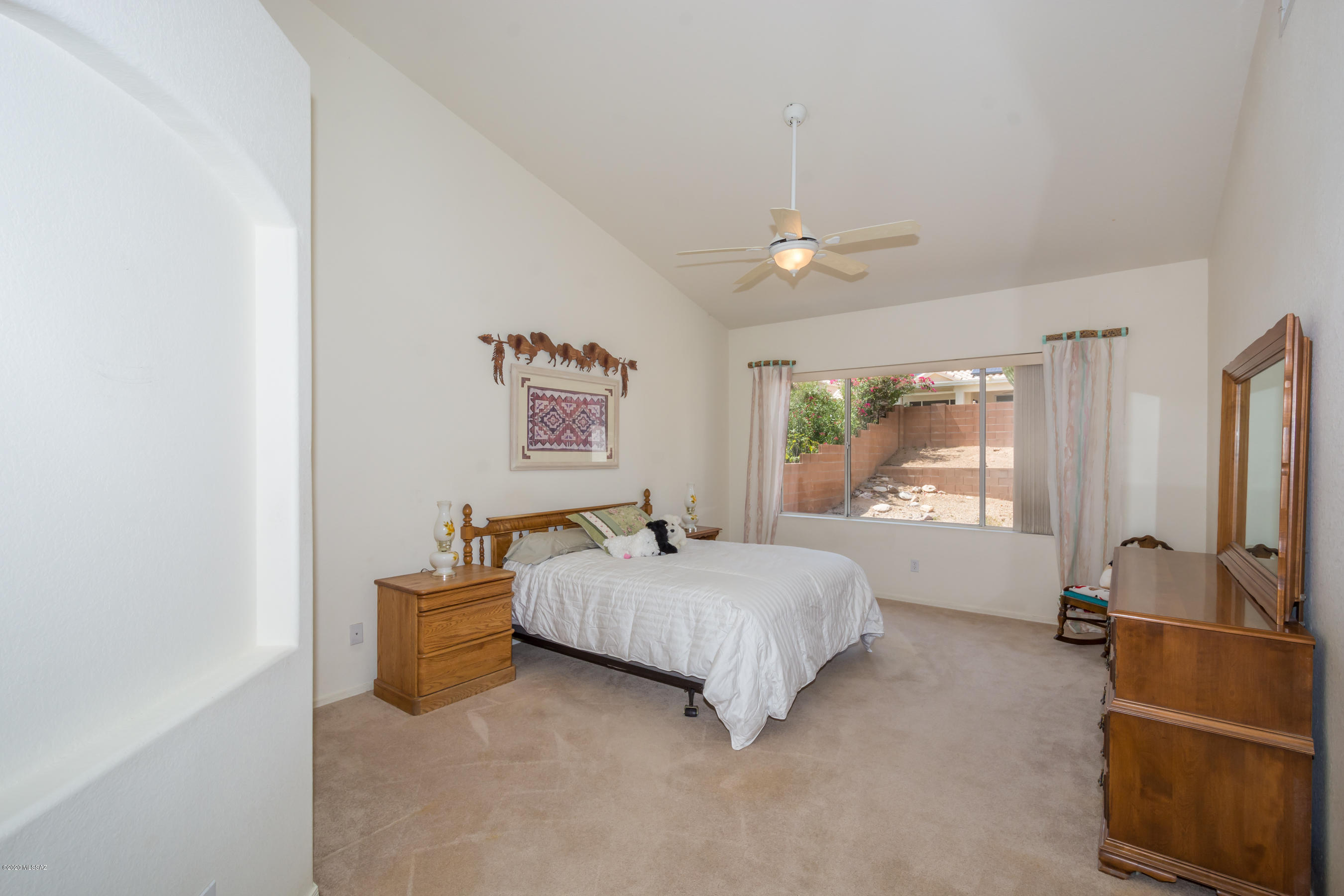 11341 Silver Pheasant Loop Oro Valley, AZ 85737 - Photo 15 of 41 a bedroom with a bed and window