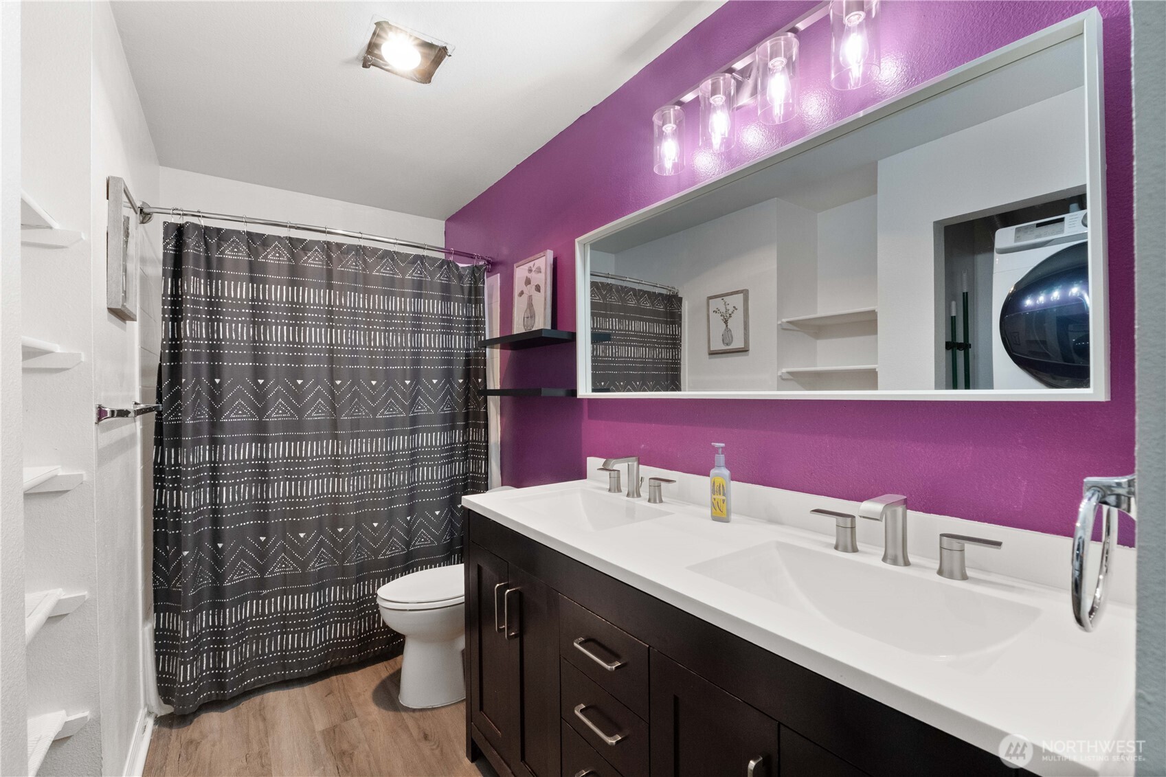 31500 33rd Place Southwest, Unit C203 Federal Way, WA 98023 - Photo 14 of 28 a bathroom with a sink a toilet a mirror and shower
