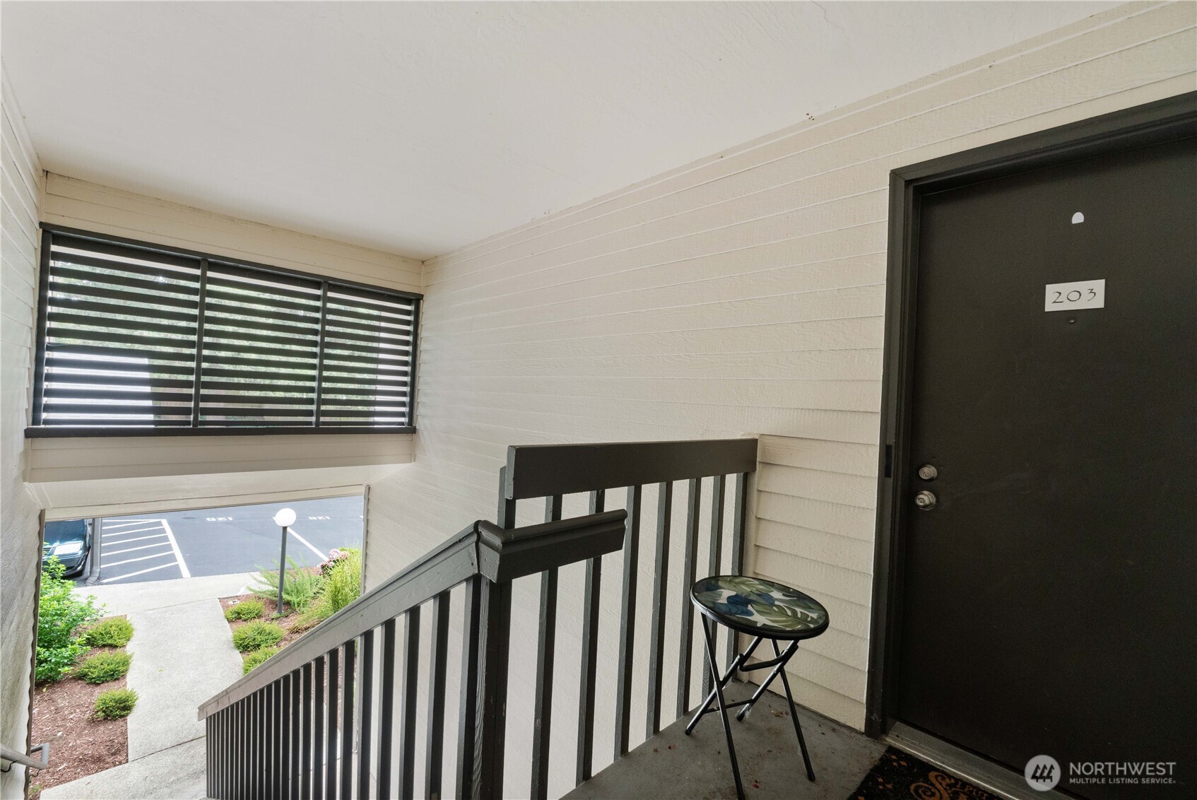31500 33rd Place Southwest, Unit C203 Federal Way, WA 98023 - Photo 23 of 28 a view of a hallway with furniture and floor to ceiling window