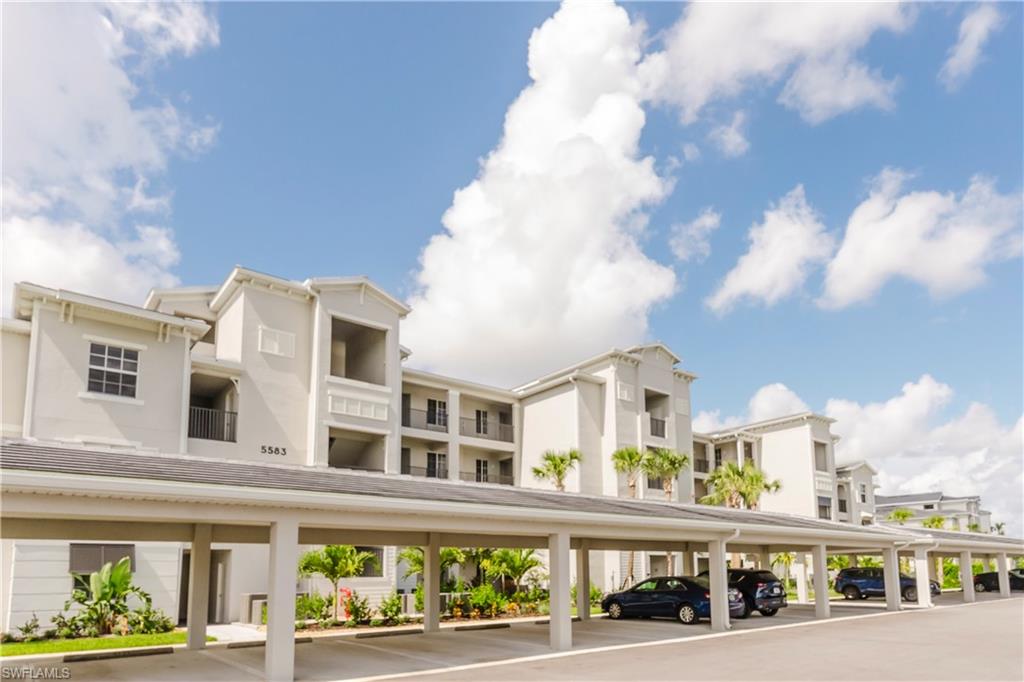 5583 Double Eagle Circle, Unit 4125 Ave Maria, FL 34142 - Photo 13 of 36 a view of a building with a street