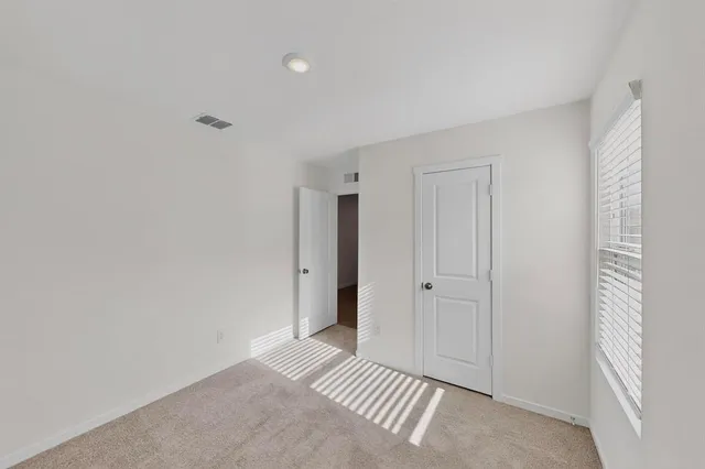a view of a bedroom with closet area