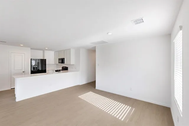 a view of a livingroom with a furniture