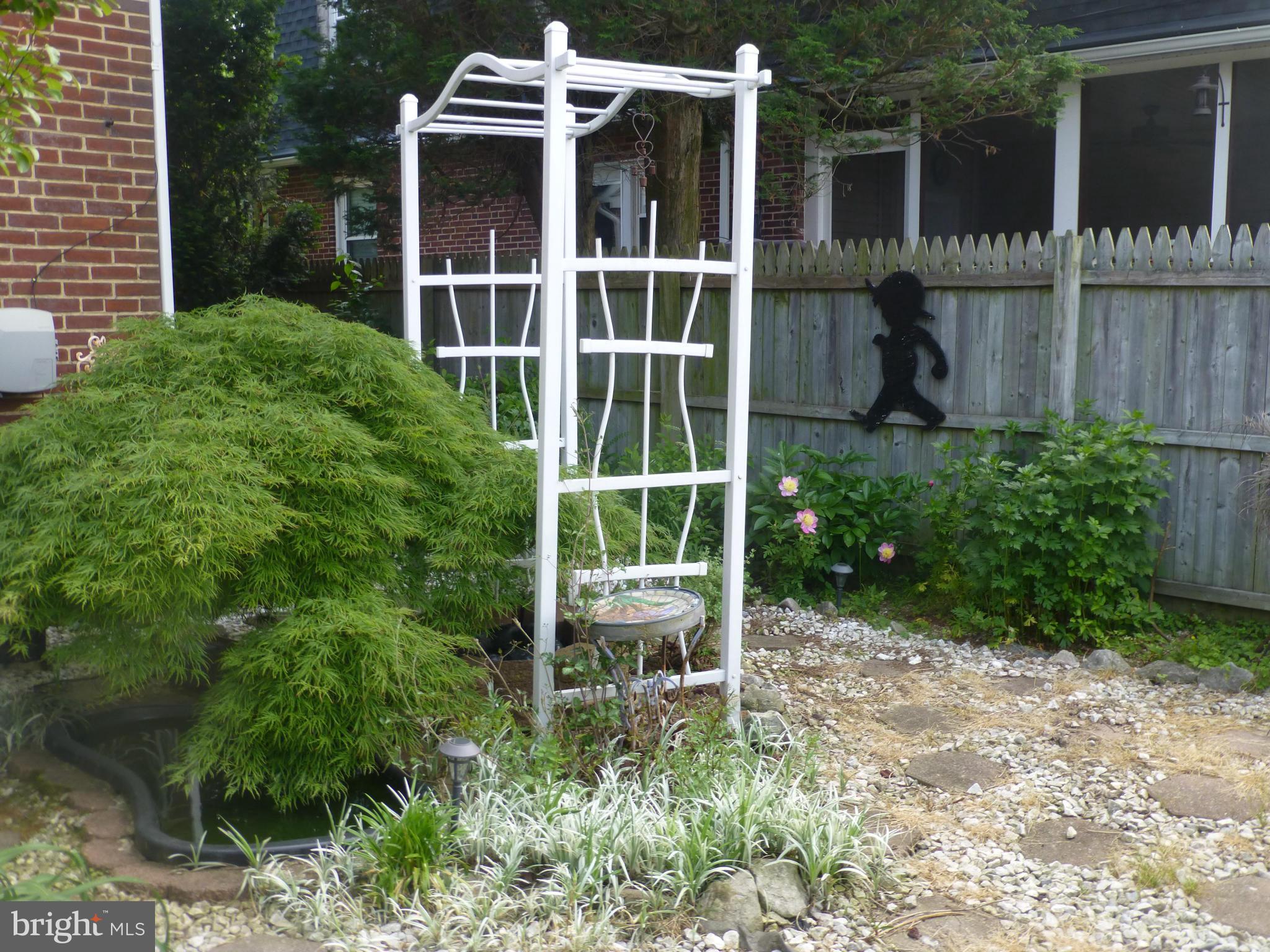 65 Northship Road Baltimore, MD 21222 - Photo 22 of 30 a view of a chair and table in the backyard