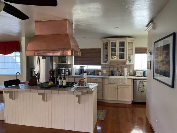 a kitchen with counter top space and appliances