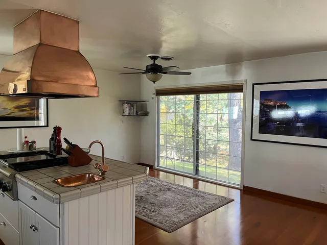 a kitchen with a stove and a sink