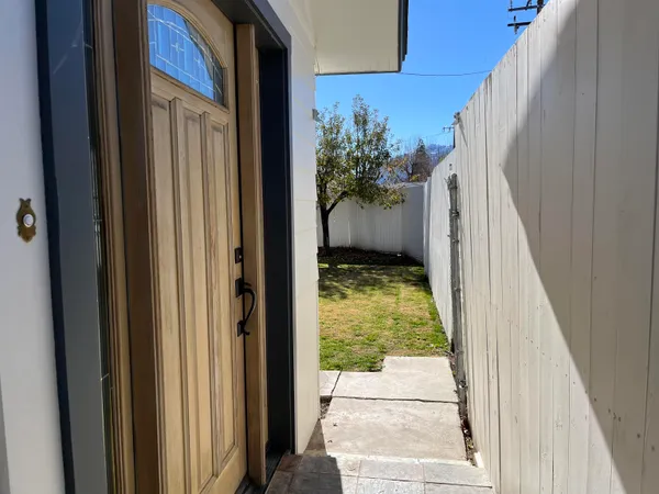 a view of a backyard of the house