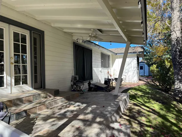 a view of a house with a tree